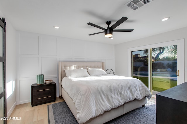 14012 N 57th Pl, Scottsdale, AZ 85254 - bedroom featuring access to outside, recessed lighting, a decorative wall, light wood finished floors, and a ceiling fan