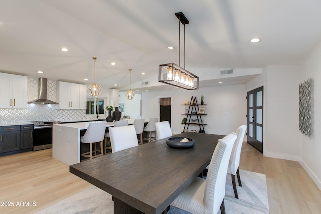 14012 N 57th Pl, Scottsdale, AZ 85254 - dining area featuring light wood-style flooring, recessed lighting, and french doors