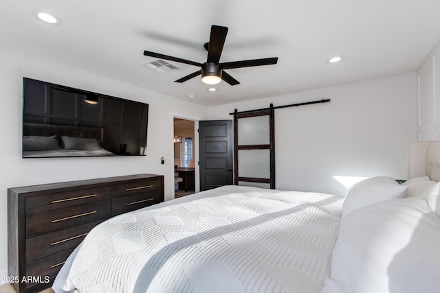 14012 N 57th Pl, Scottsdale, AZ 85254 - bedroom with a barn door, recessed lighting, and ceiling fan