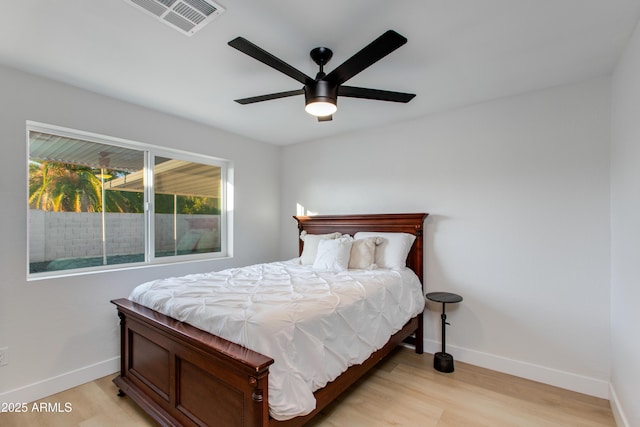 14012 N 57th Pl, Scottsdale, AZ 85254 - bedroom with light wood-style flooring and a ceiling fan