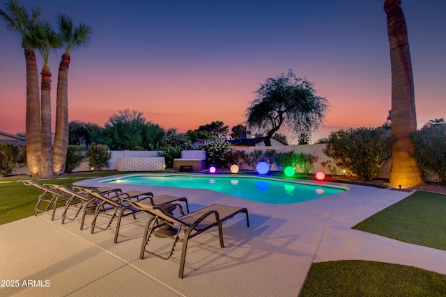14012 N 57th Pl, Scottsdale, AZ 85254 - pool at dusk featuring a fenced backyard and a patio