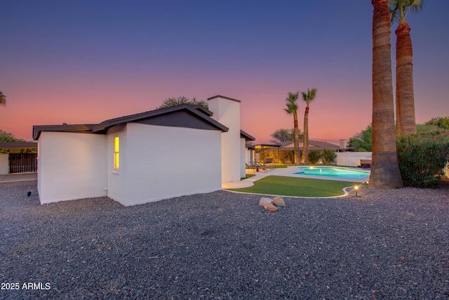 14012 N 57th Pl, Scottsdale, AZ 85254 - exterior space featuring a patio area, a chimney, and a fenced backyard
