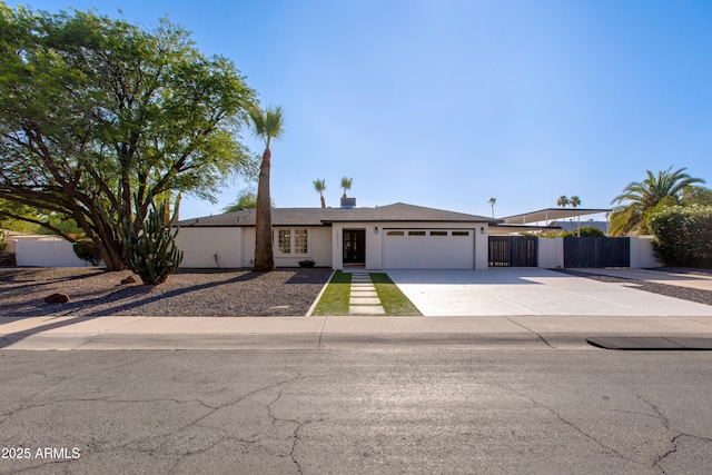 14012 N 57th Pl, Scottsdale, AZ 85254 - single story home featuring a garage, concrete driveway, and stucco siding