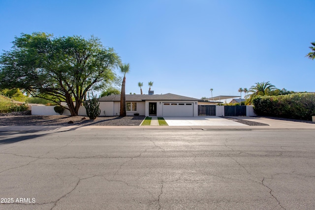 14012 N 57th Pl, Scottsdale, AZ 85254 - single story home with a garage, concrete driveway, and stucco siding
