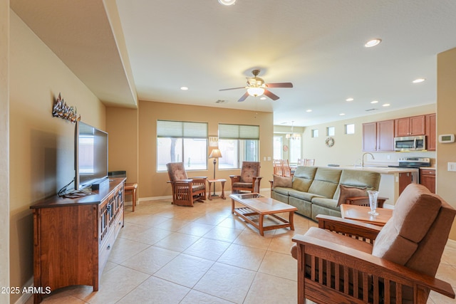 tiled living room with sink and ceiling fan