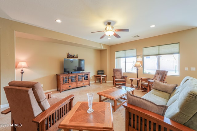 living room with light tile patterned flooring and ceiling fan