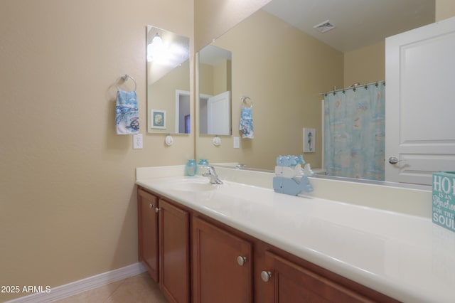 bathroom featuring vanity and tile patterned flooring