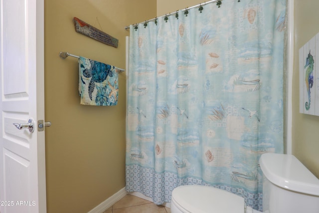 bathroom with tile patterned flooring, a shower with shower curtain, and toilet