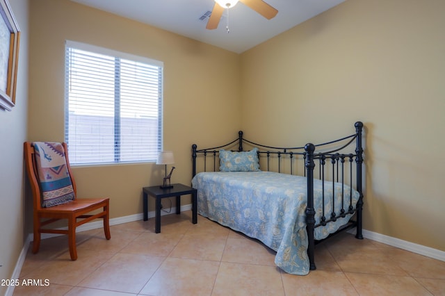 tiled bedroom with ceiling fan