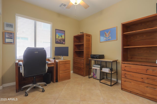 tiled home office featuring ceiling fan