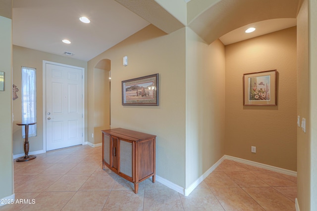 hallway featuring light tile patterned floors