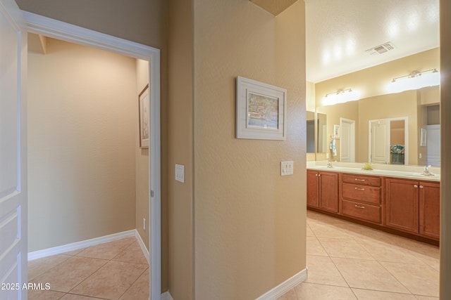 bathroom with vanity and tile patterned floors