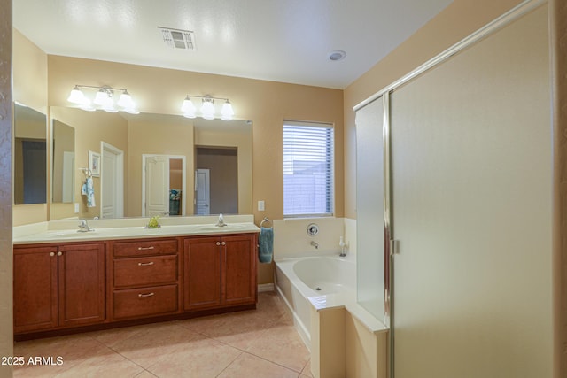 bathroom featuring tile patterned floors, independent shower and bath, and vanity