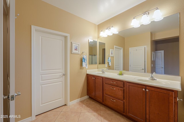 bathroom with tile patterned flooring and vanity