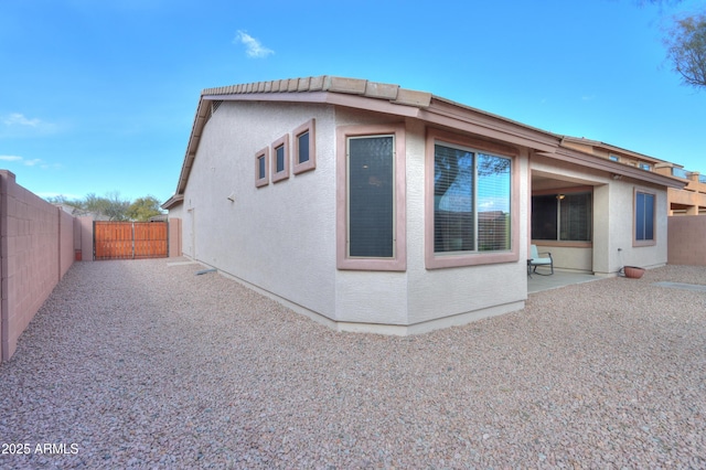 rear view of house featuring a patio area