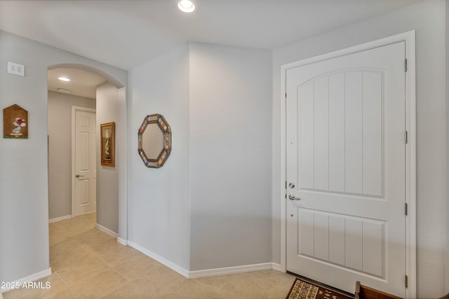 foyer entrance featuring light tile patterned floors