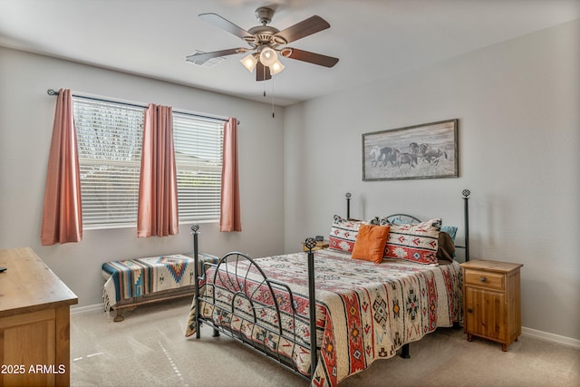 bedroom featuring light colored carpet and ceiling fan