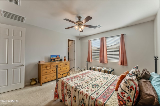 bedroom with light carpet and ceiling fan