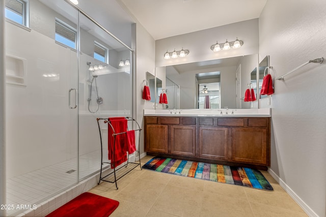 bathroom with tile patterned floors, vanity, and an enclosed shower