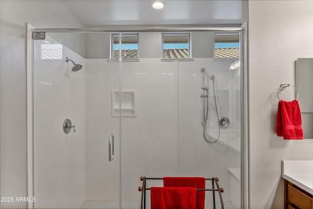 bathroom with vanity and an enclosed shower