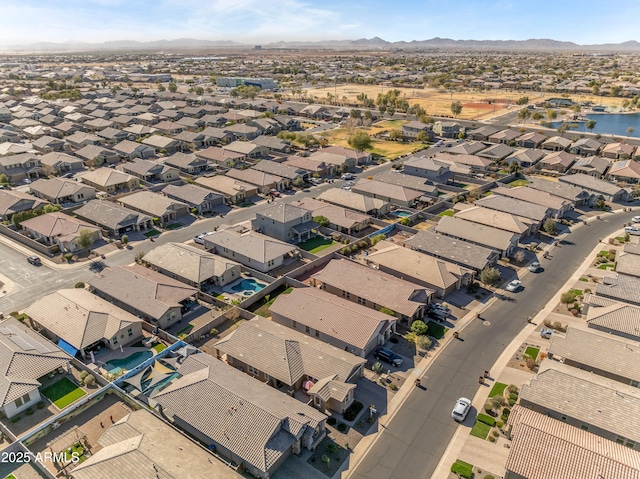 birds eye view of property featuring a mountain view