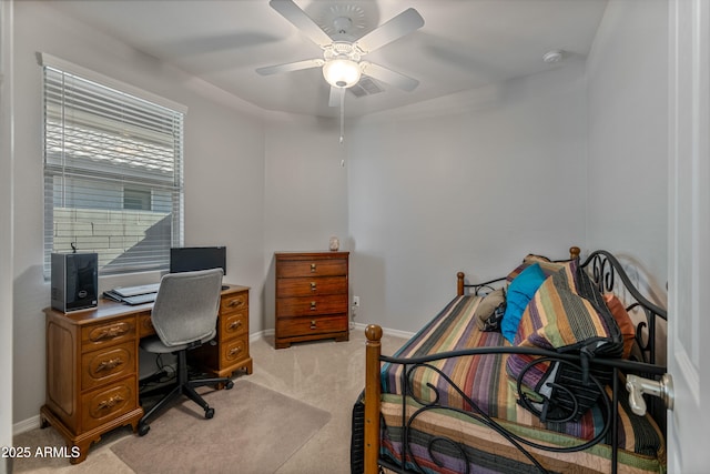 bedroom with light carpet and ceiling fan