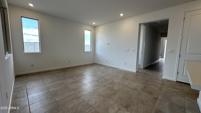 spare room with a wealth of natural light