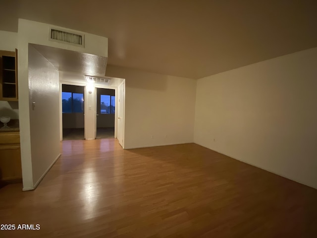 spare room featuring visible vents and light wood-style floors