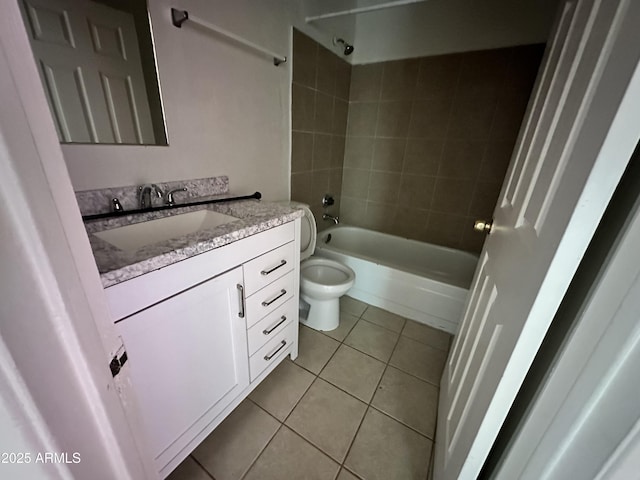 bathroom with tile patterned floors, toilet, shower / washtub combination, and vanity