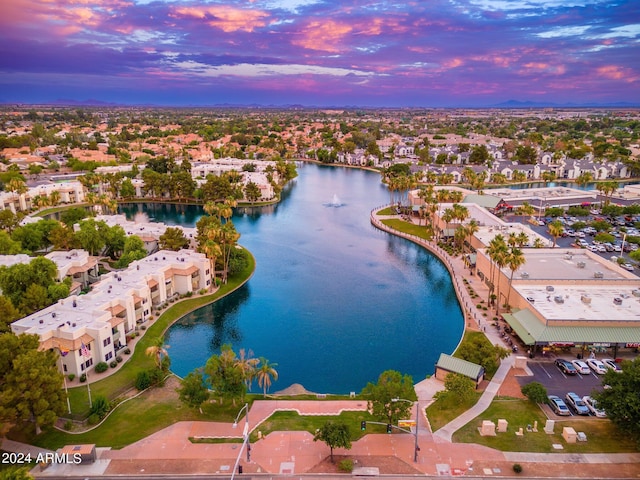 aerial view at dusk with a water view