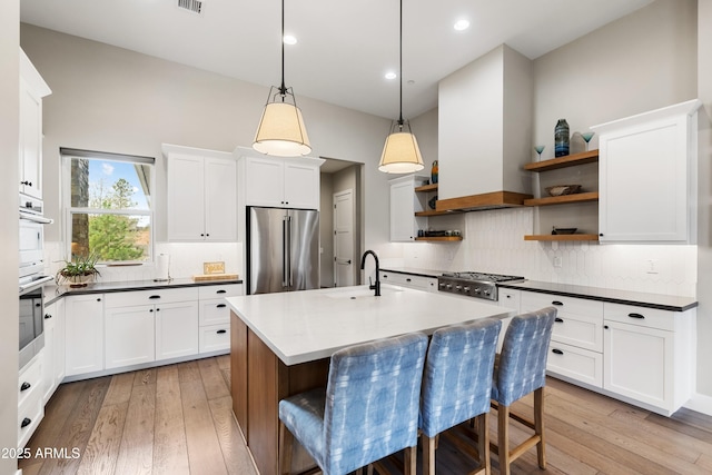 1417 Eureka Ridge Way, Prescott, AZ 86303 - kitchen with appliances with stainless steel finishes, open shelves, backsplash, hanging light fixtures, and recessed lighting