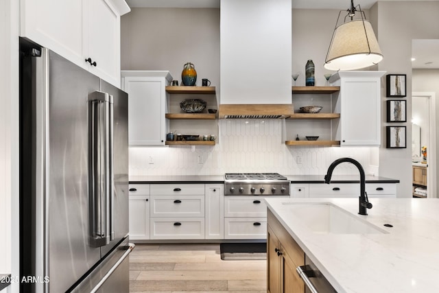 1417 Eureka Ridge Way, Prescott, AZ 86303 - kitchen with appliances with stainless steel finishes, open shelves, a sink, and light wood-style floors