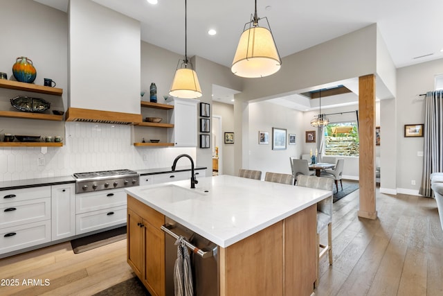 1417 Eureka Ridge Way, Prescott, AZ 86303 - kitchen with a sink, open shelves, stainless steel gas stovetop, light wood-style floors, and tasteful backsplash