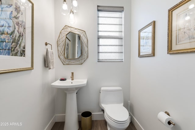 1417 Eureka Ridge Way, Prescott, AZ 86303 - bathroom featuring toilet, baseboards, and a sink