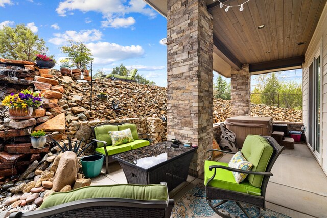 1417 Eureka Ridge Way, Prescott, AZ 86303 - view of patio / terrace with a hot tub and an outdoor hangout area