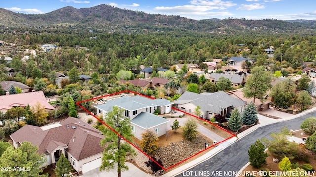 1417 Eureka Ridge Way, Prescott, AZ 86303 - aerial view of residential area with mountains, property parcel outlined, and a forest
