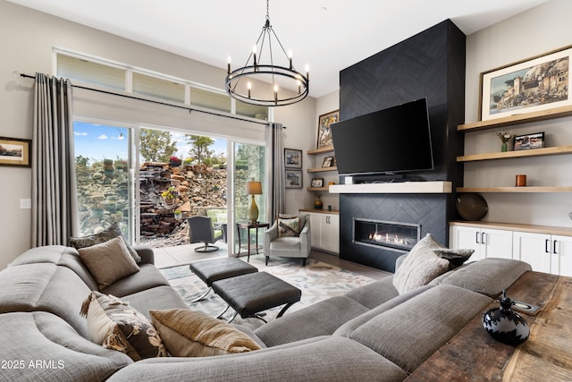 1417 Eureka Ridge Way, Prescott, AZ 86303 - living area featuring a chandelier, a fireplace, and light wood-style flooring