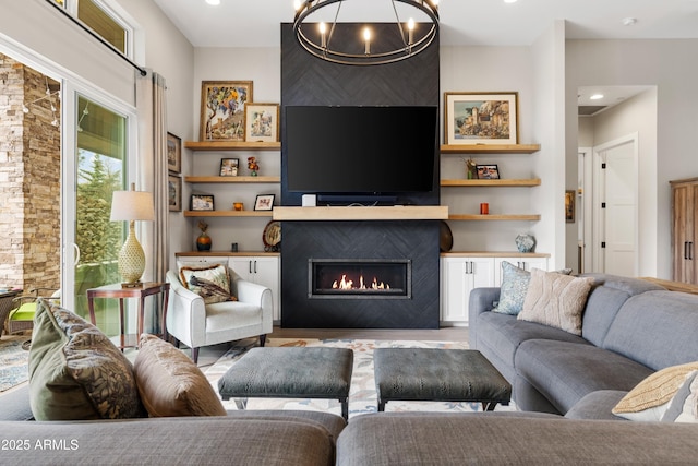 1417 Eureka Ridge Way, Prescott, AZ 86303 - living room with a fireplace, wood finished floors, a chandelier, recessed lighting, and built in shelves