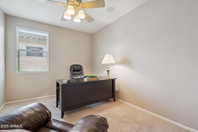 office space with baseboards, a ceiling fan, and carpet flooring