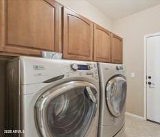 laundry room with cabinet space and washing machine and dryer