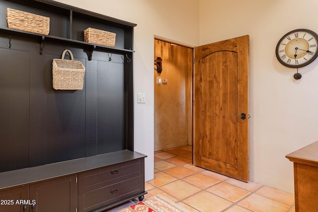 mudroom with light tile patterned floors