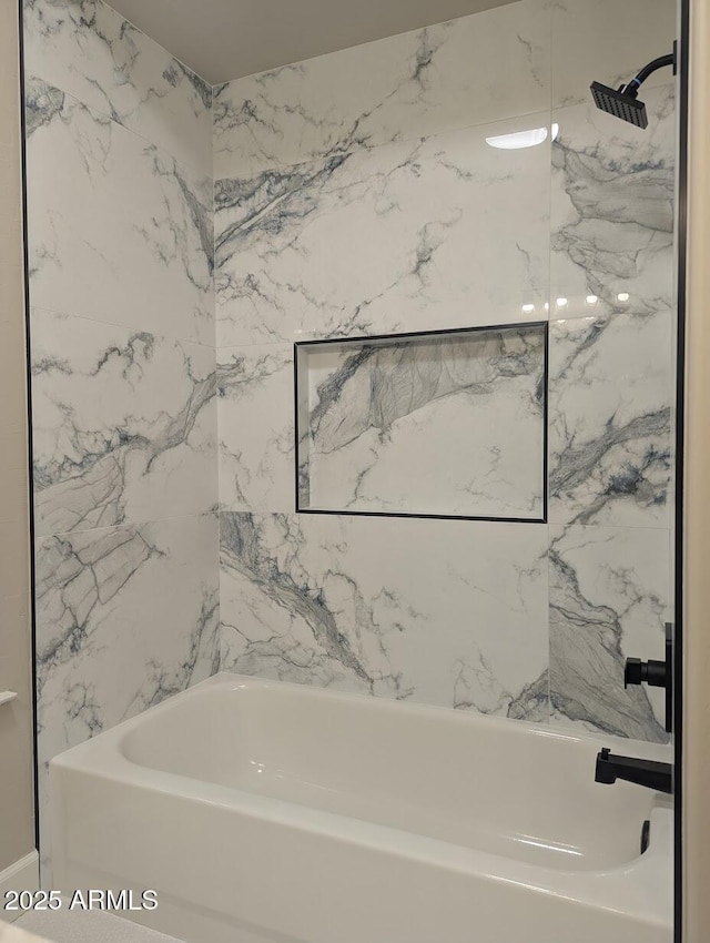 full bath featuring bathing tub / shower combination