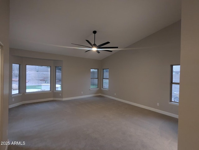 carpeted empty room featuring ceiling fan, baseboards, healthy amount of natural light, and high vaulted ceiling