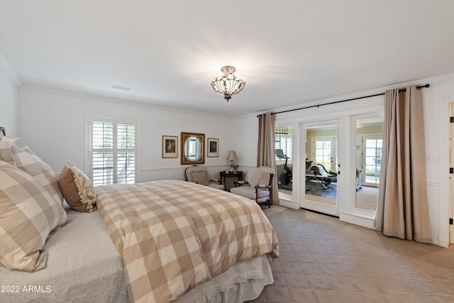 carpeted bedroom featuring ornamental molding and access to outside