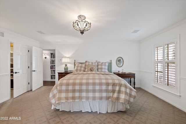 bedroom with light colored carpet and ornamental molding