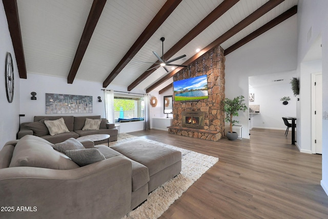 1444 E Myrna Ln, Tempe, AZ 85284 - living area featuring a ceiling fan, high vaulted ceiling, beam ceiling, a fireplace, and wood finished floors