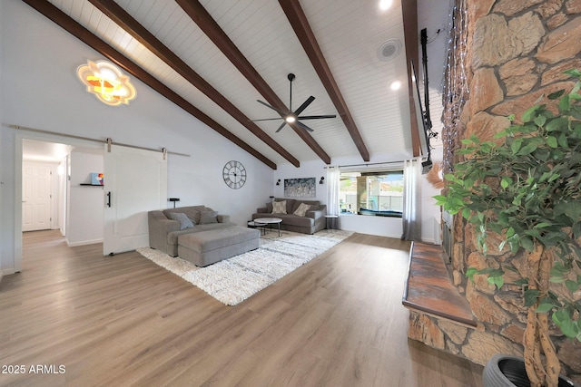1444 E Myrna Ln, Tempe, AZ 85284 - living area with a barn door, beam ceiling, wood finished floors, high vaulted ceiling, and ceiling fan