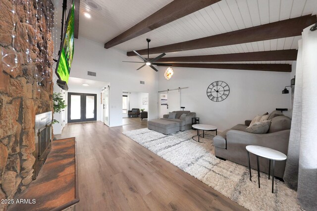 1444 E Myrna Ln, Tempe, AZ 85284 - living area with wood finished floors, ceiling fan, and a fireplace