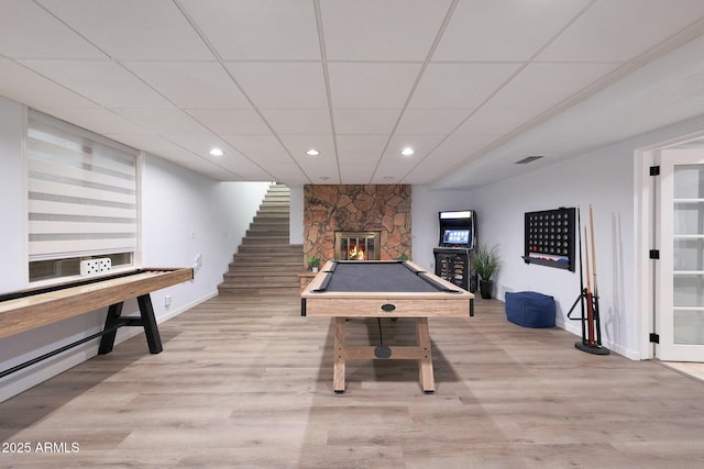 1444 E Myrna Ln, Tempe, AZ 85284 - recreation room featuring a paneled ceiling, a stone fireplace, wood finished floors, baseboards, and recessed lighting