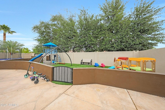 1444 E Myrna Ln, Tempe, AZ 85284 - view of playground featuring a trampoline, fence, and a gate